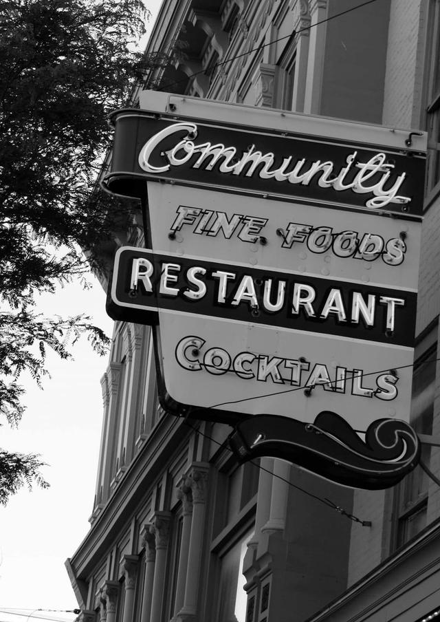 The Community Restaurant building and sign in downtown Cortland, black and white
